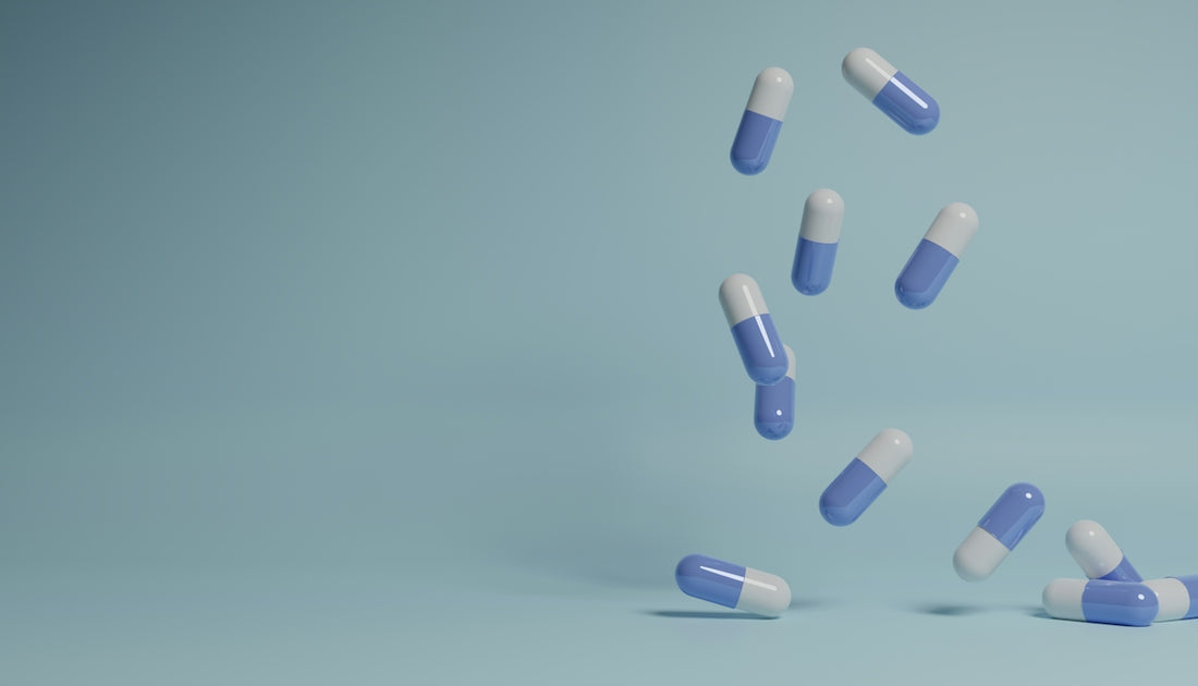 a group of pills falling into the air