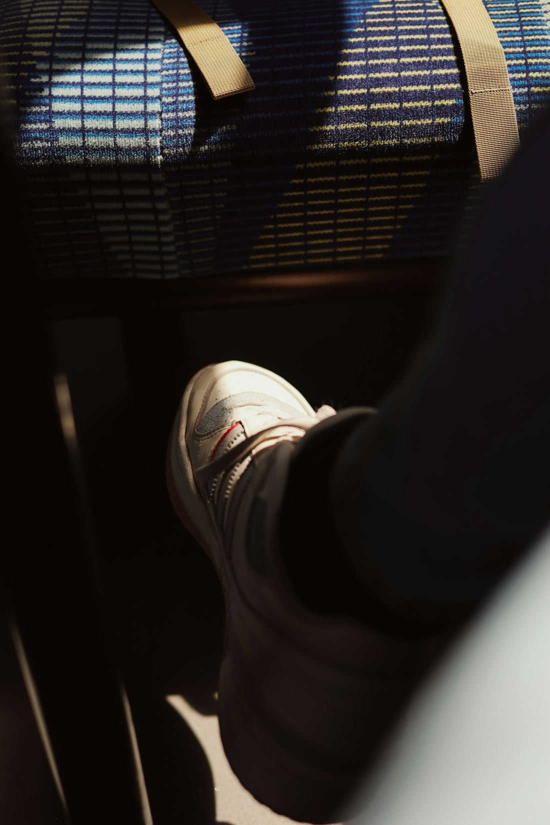 a person standing next to a luggage bag