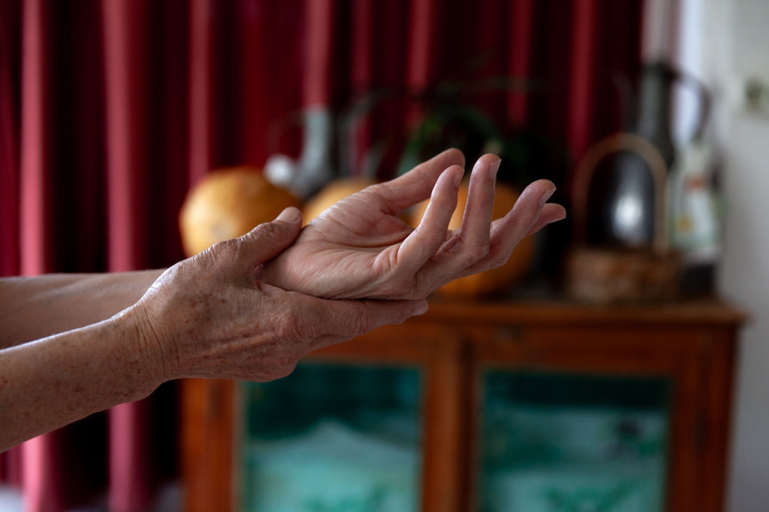 A woman holding out her hands in a living room