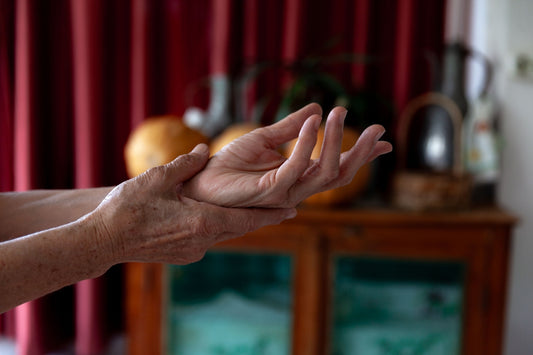 A woman holding out her hands in a living room