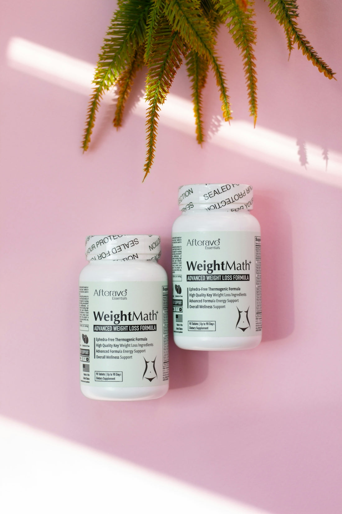 Two bottles of weight matters on a pink background